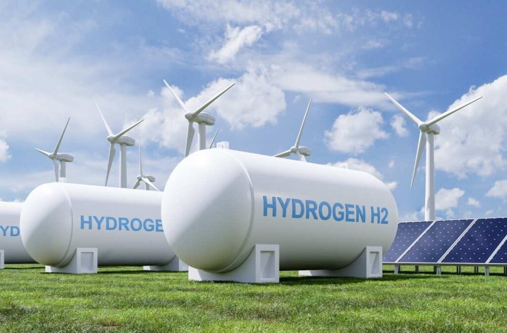 Hydrogen outlook 2026 concept showing hydrogen storage tanks with wind turbines and solar panels